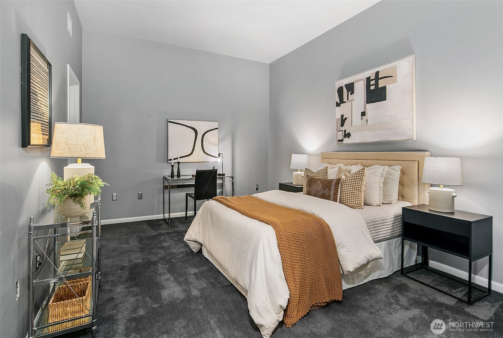 17 West Mercer Street, Unit 302 Seattle, WA 98119 - Photo 20 of 28 a bedroom with a bed and lamp