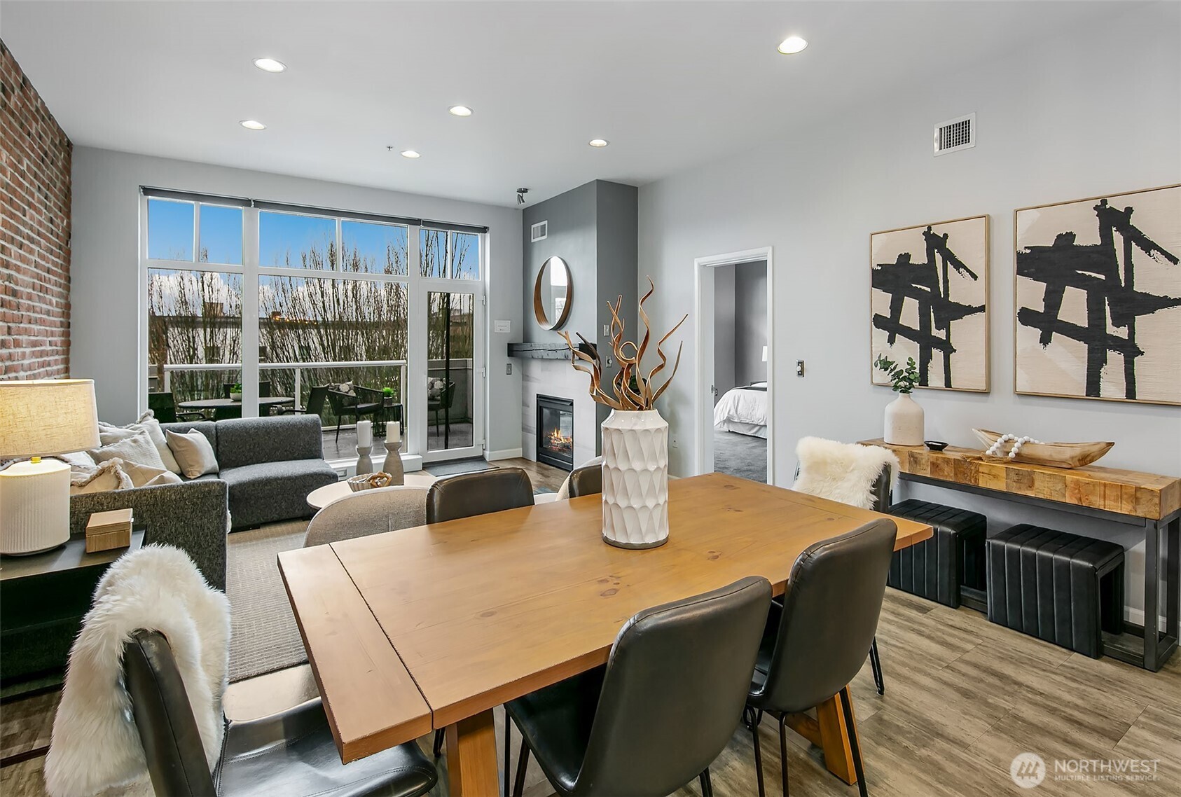 17 West Mercer Street, Unit 302 Seattle, WA 98119 - Photo 2 of 28 a view of a dining room with furniture and wooden floor