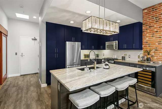 a kitchen with refrigerator and cabinets