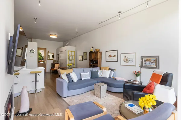 a living room with furniture fireplace and a flat screen tv