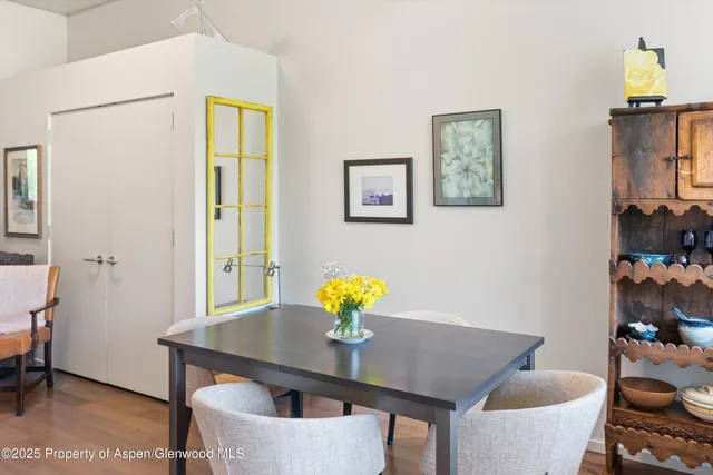 a view of a dining room with furniture and lamp