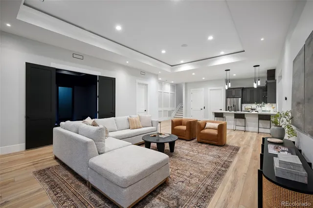 a bathroom with a sink vanity mirror and toilet