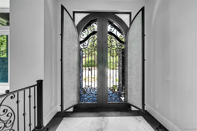 a living room with fireplace furniture and a large window
