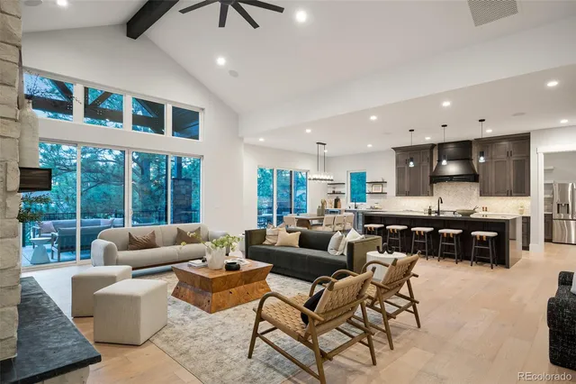 a living room with fireplace furniture and a flat screen tv