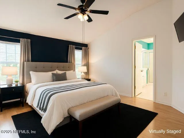 a bedroom with a bed and a walk in closet