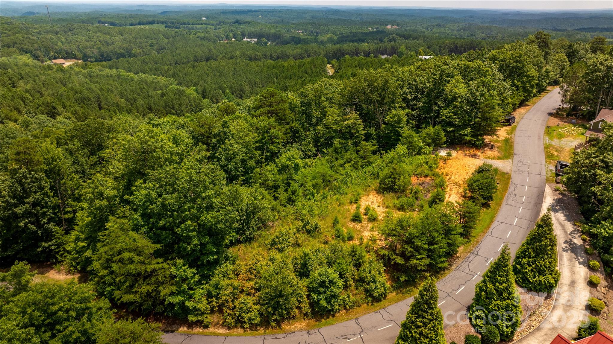 240 Boulder Ridge Lake Lure, NC 28746 - Photo 11 of 28 an aerial view of residential houses with outdoor space and trees
