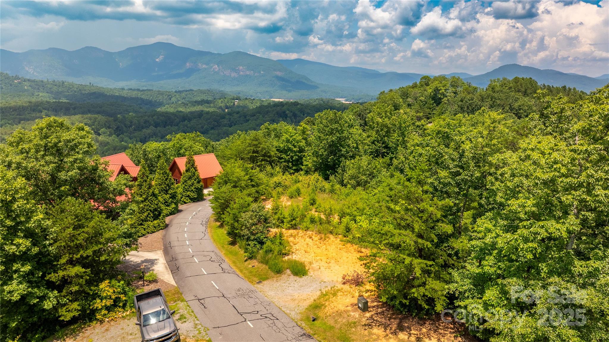 240 Boulder Ridge Lake Lure, NC 28746 - Photo 15 of 28 a view of a lake with a mountain in the background