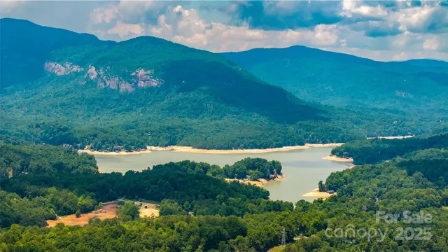 a view of a lake with a house in the background
