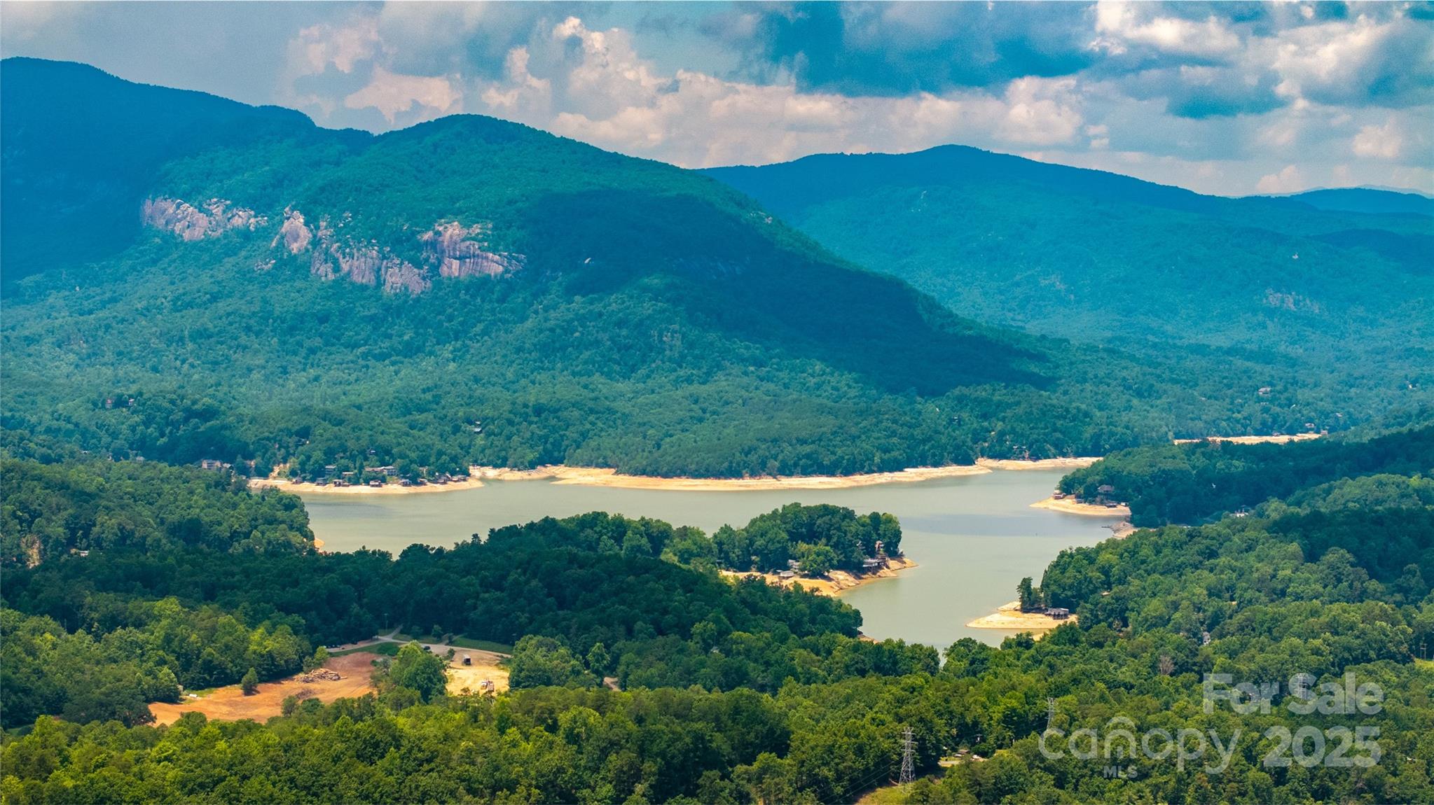 240 Boulder Ridge Lake Lure, NC 28746 - Photo 19 of 28 a view of a lake with a house in the background