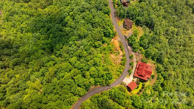 an aerial view of a house with a yard and outdoor space