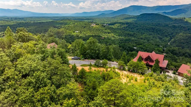 a view of a lake with a house in the background