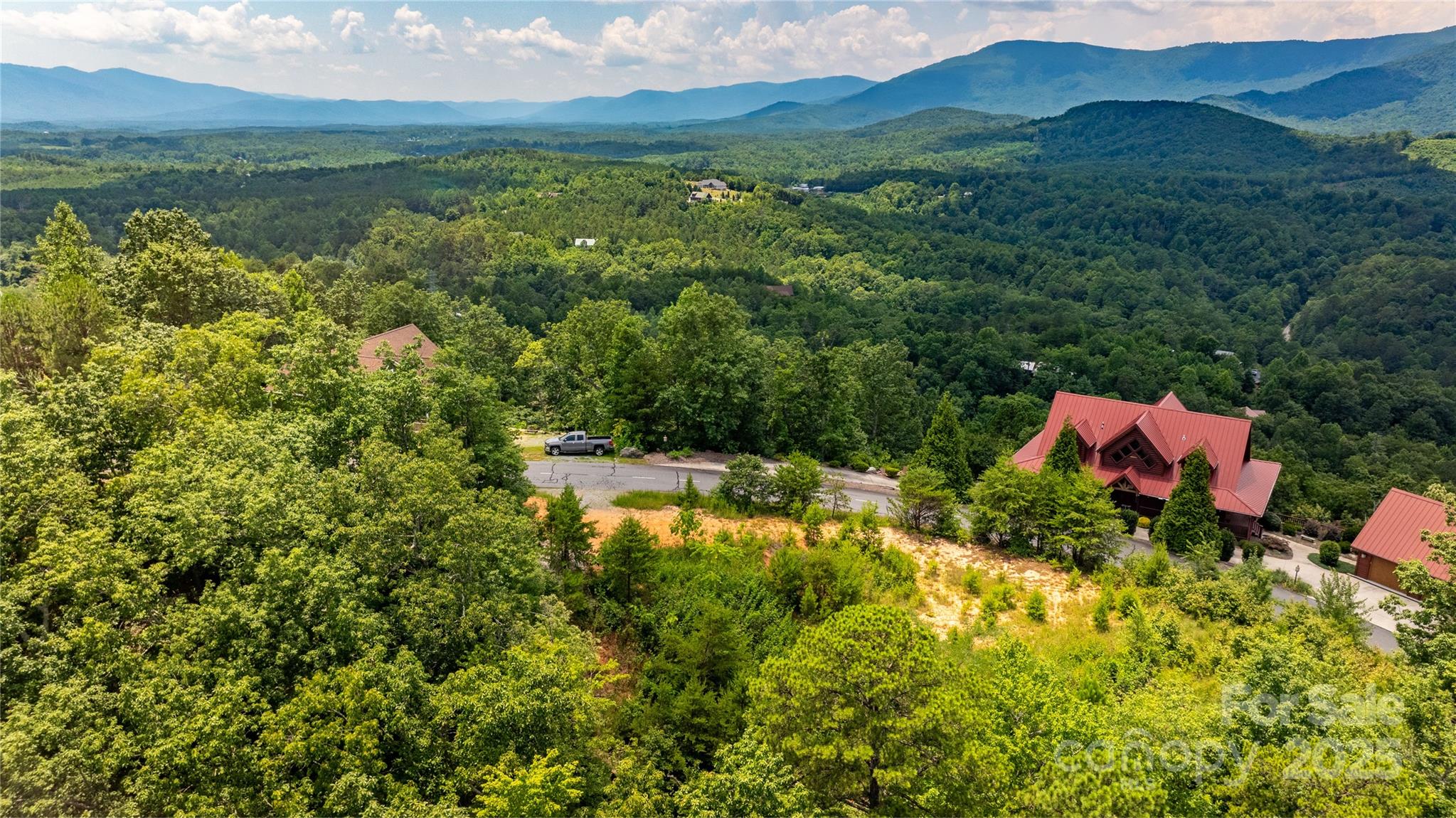 240 Boulder Ridge Lake Lure, NC 28746 - Photo 6 of 28 a view of a lake with a house in the background