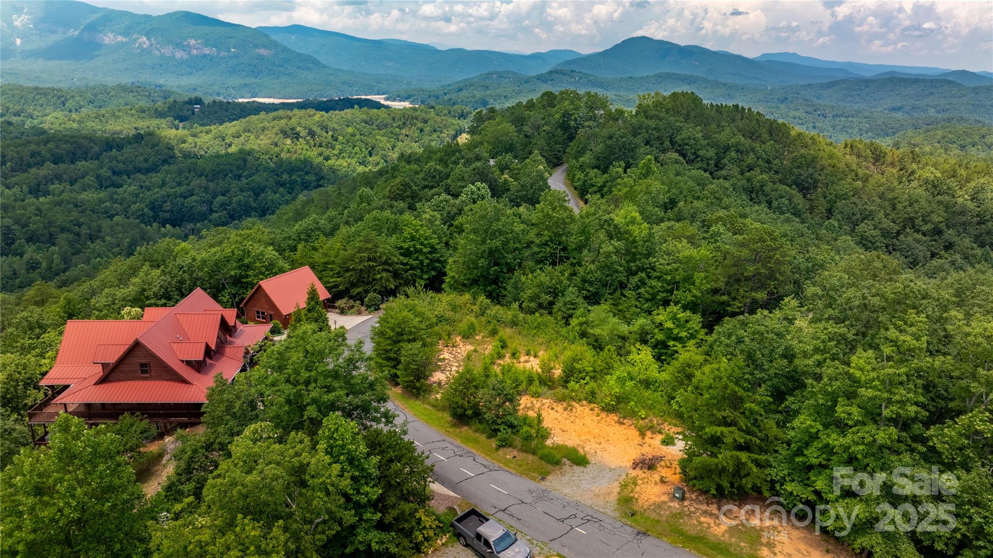 240 Boulder Ridge Lake Lure, NC 28746 - Photo 8 of 28 an aerial view of house yard and mountain view in back