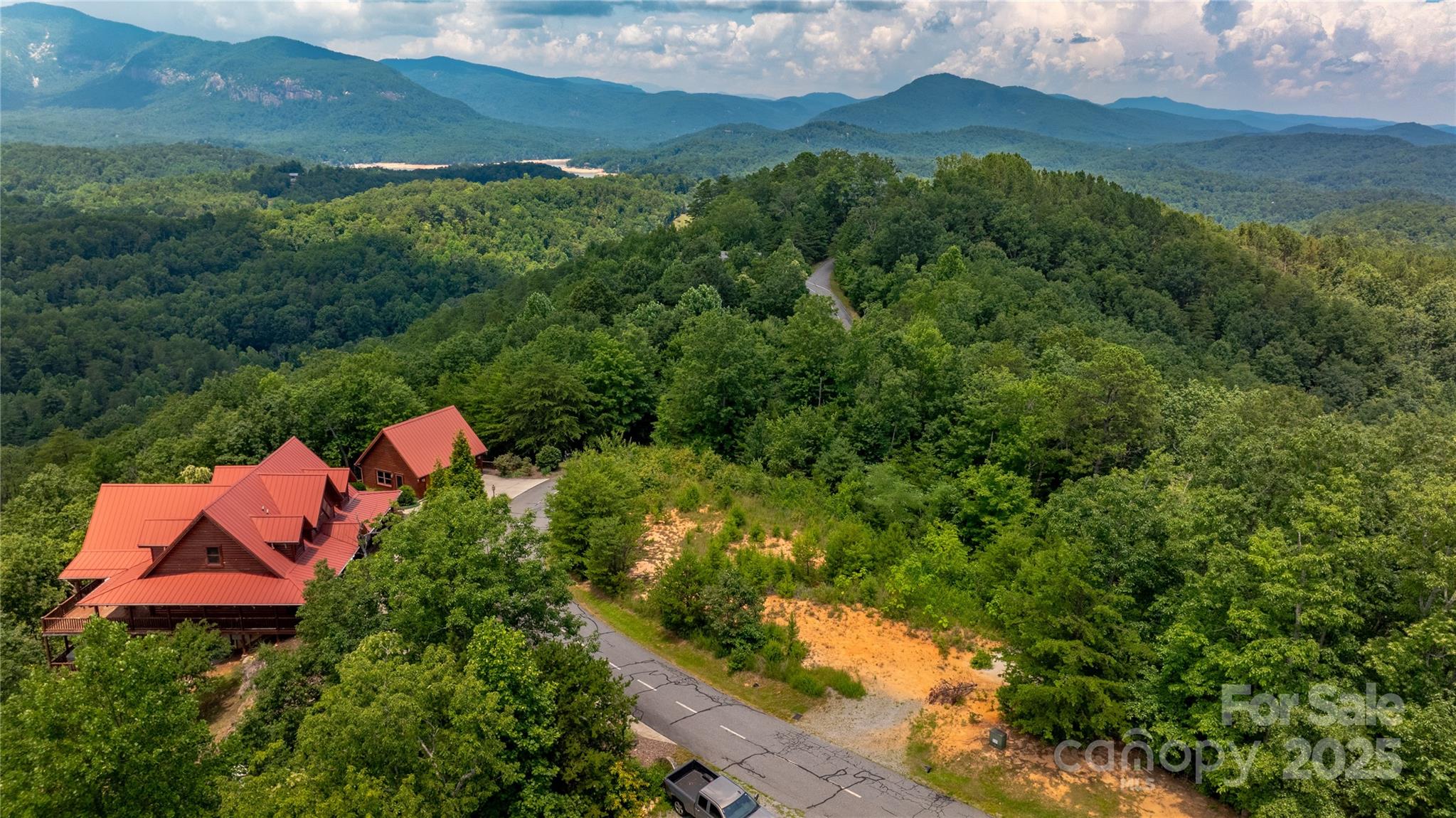 240 Boulder Ridge Lake Lure, NC 28746 - Photo 9 of 28 an aerial view of house with yard and mountain view in back