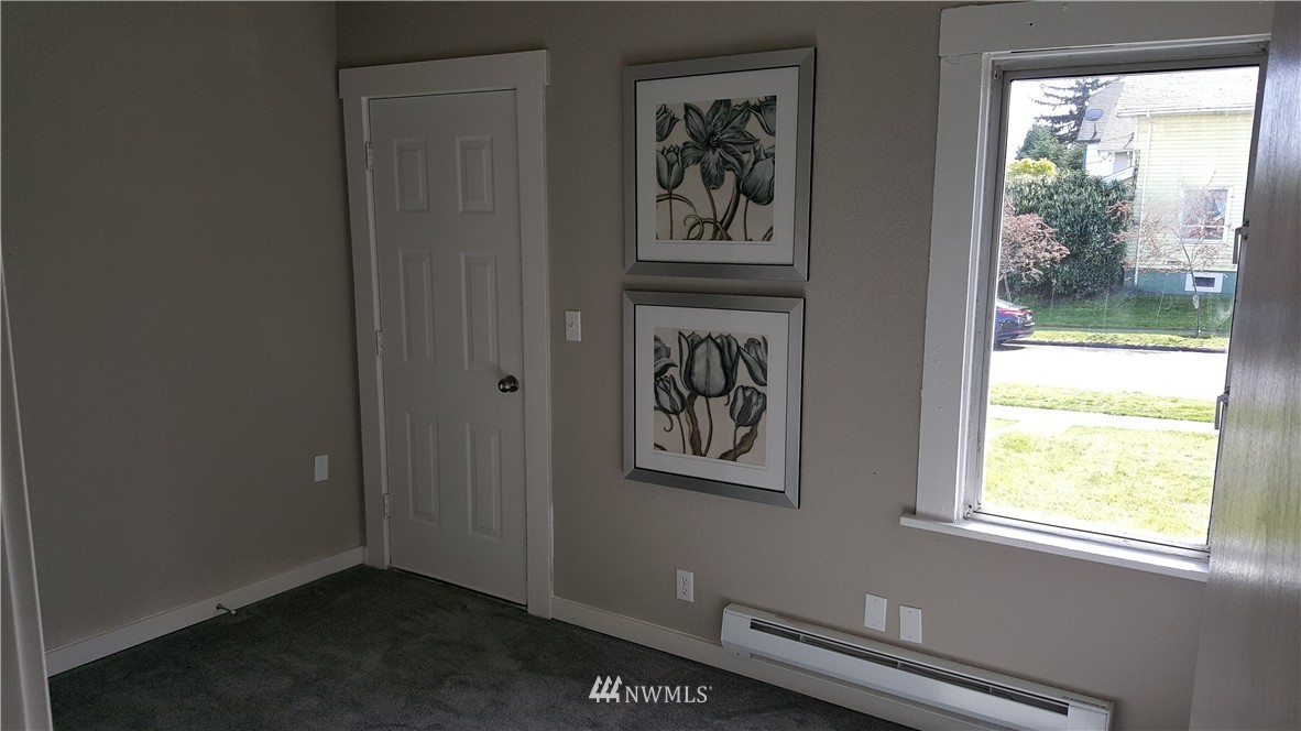 2129 Rockefeller Avenue Everett, WA 98201 - Photo 5 of 8 a view of wooden floor and a window in a room