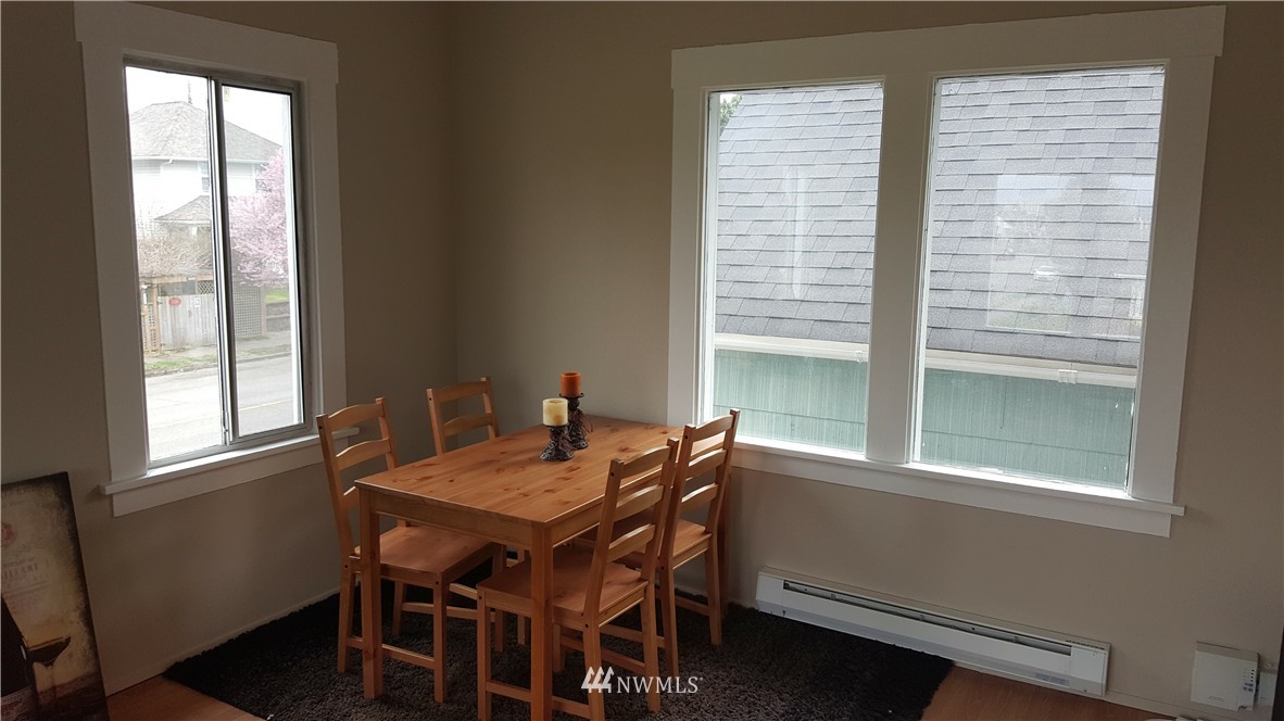 2129 Rockefeller Avenue Everett, WA 98201 - Photo 8 of 8 a view of a dining room with a table and chairs