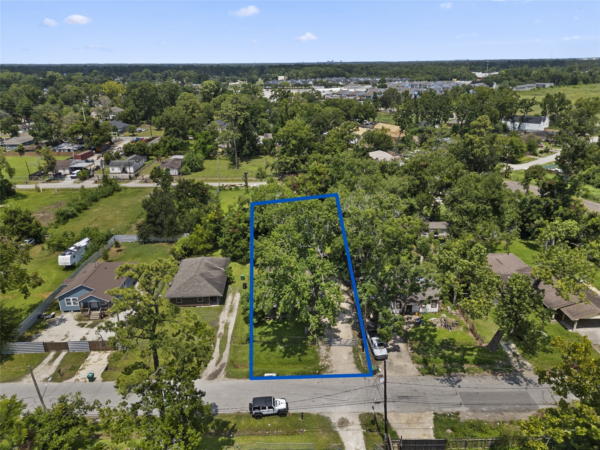 9313 Sherbourne Street Houston, TX 77016 - Photo 1 of 6 an aerial view of residential houses with outdoor space and trees