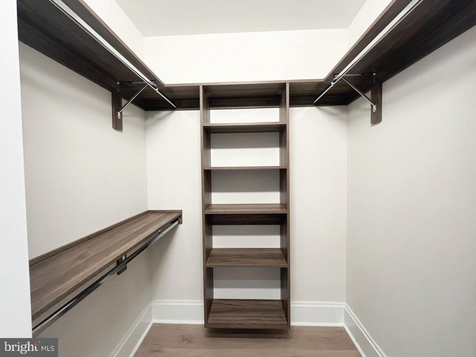 7887 Jones Branch Drive, Unit 1104 McLean, VA 22102 - Photo 17 of 42 a view of walk in closet with empty racks