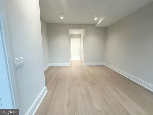 a view of wooden floor and windows in a room