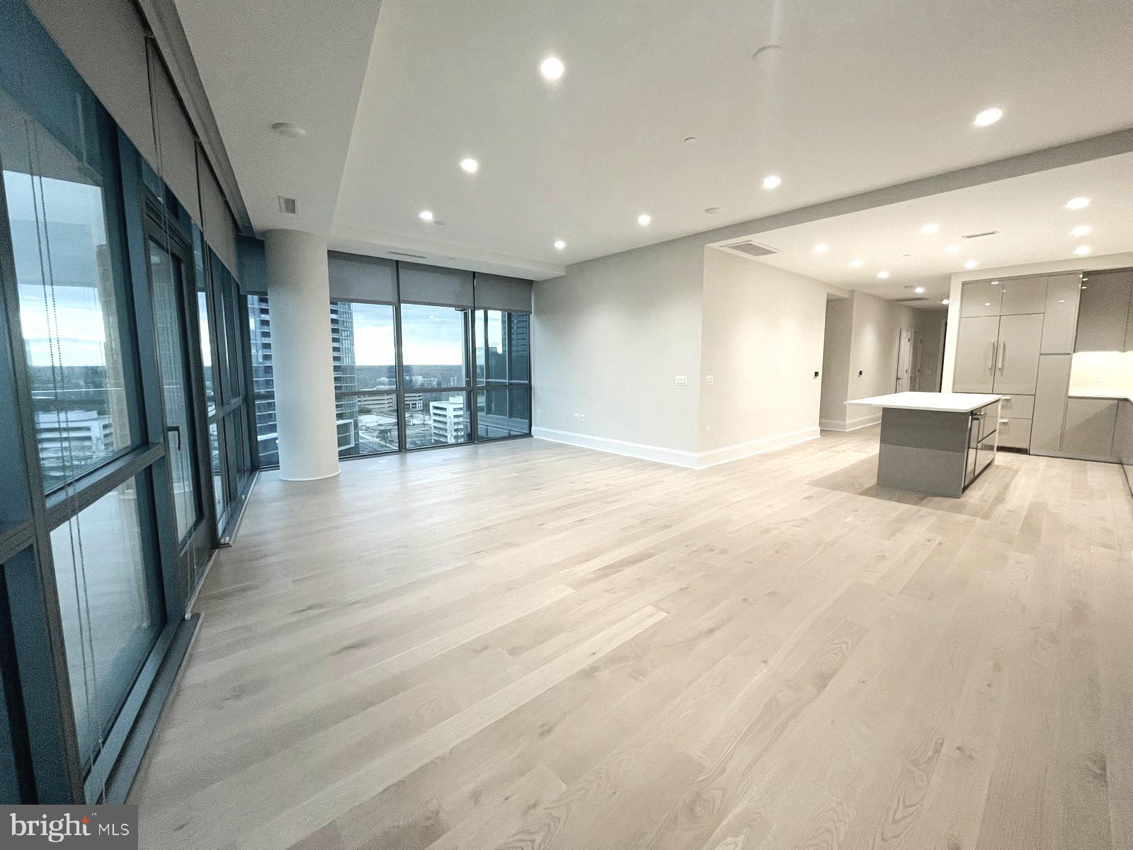 7887 Jones Branch Drive, Unit 1104 McLean, VA 22102 - Photo 3 of 42 a view of a big room with windows and chandelier