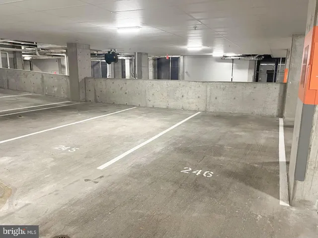 a view of a refrigerator in kitchen and a window