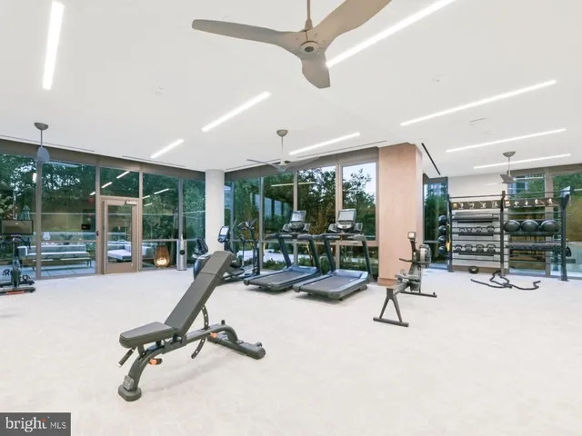 a view of a gym with gym equipment