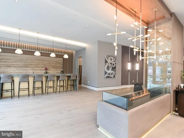 a spacious kitchen with a table and chairs