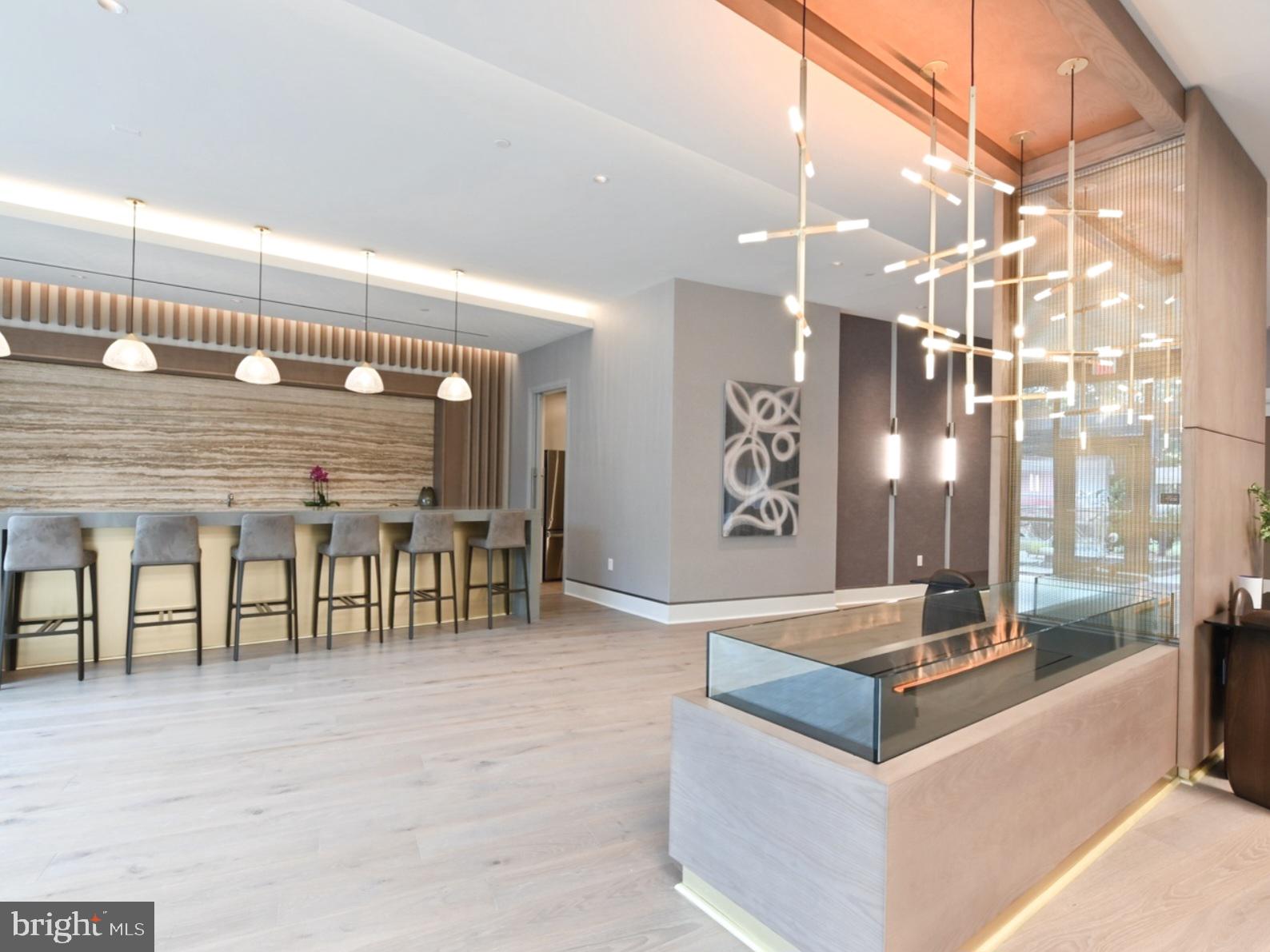 7887 Jones Branch Drive, Unit 1104 McLean, VA 22102 - Photo 42 of 42 a spacious kitchen with a table and chairs