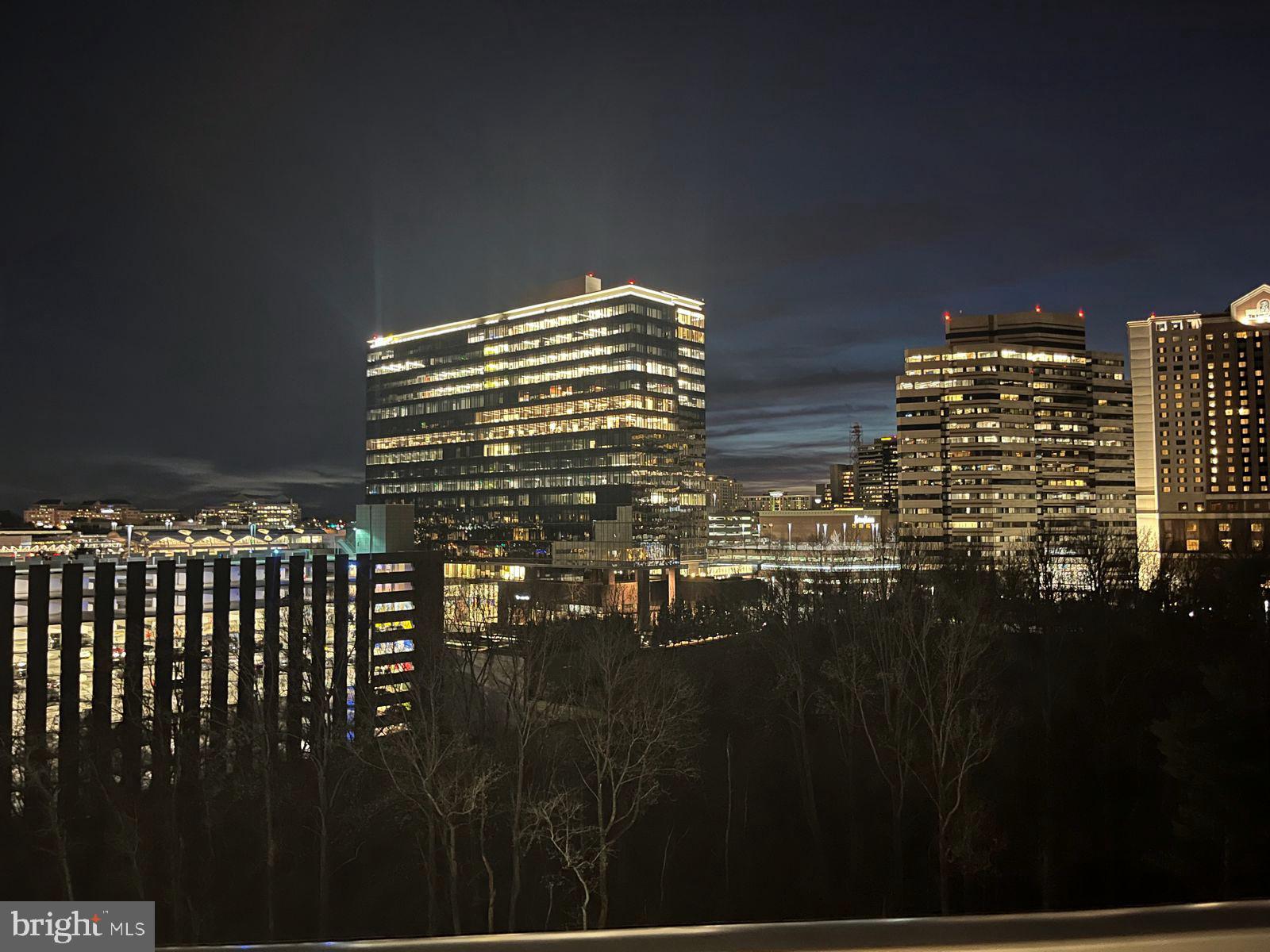 7887 Jones Branch Drive, Unit 1104 McLean, VA 22102 - Photo 9 of 42 a view of building with yard