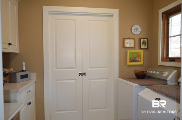 8919 Red Fish Pt Road Lillian, AL 36549 - Photo 29 of 46 Large laundry room with drying closet and built-ins.