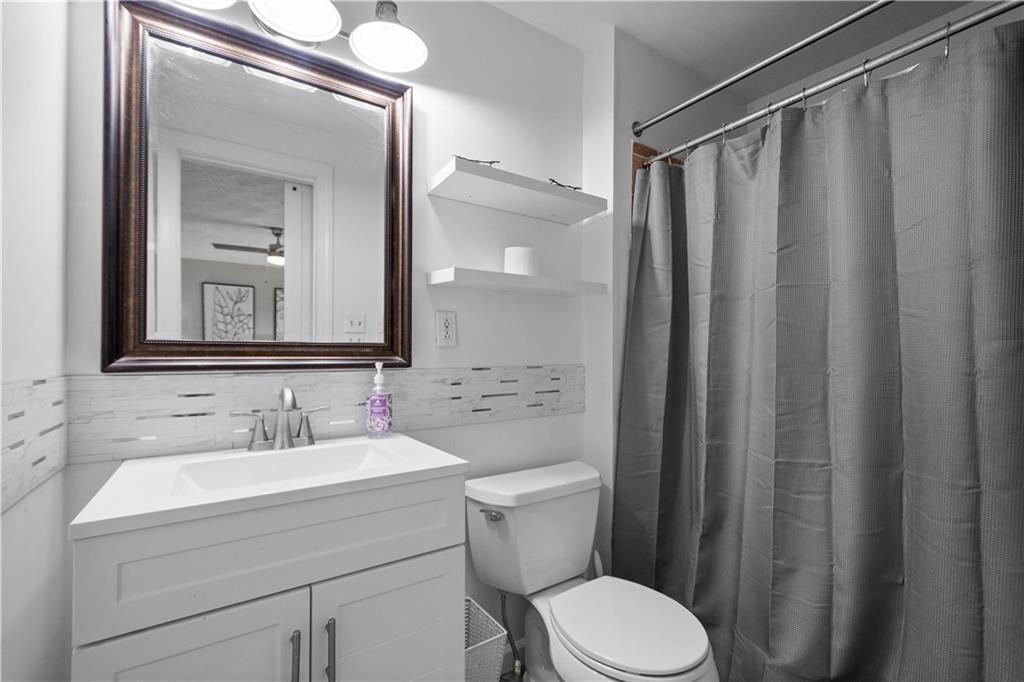 201 Arcola Drive Coraopolis, PA 15108 - Photo 20 of 33 a bathroom with a sink mirror vanity and toilet