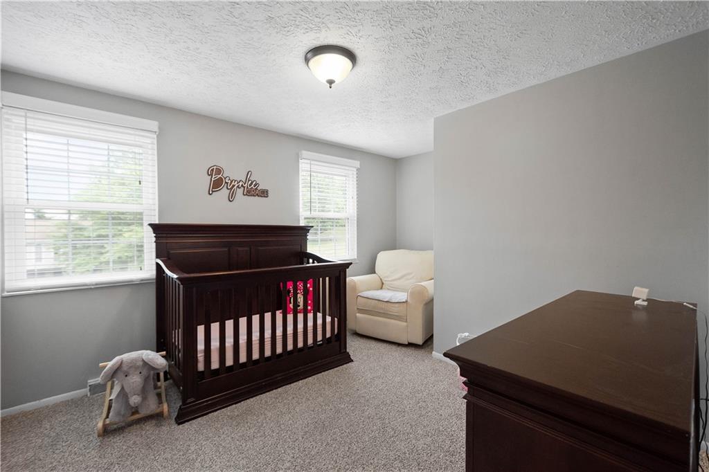 201 Arcola Drive Coraopolis, PA 15108 - Photo 23 of 33 a bedroom with a bed and a window