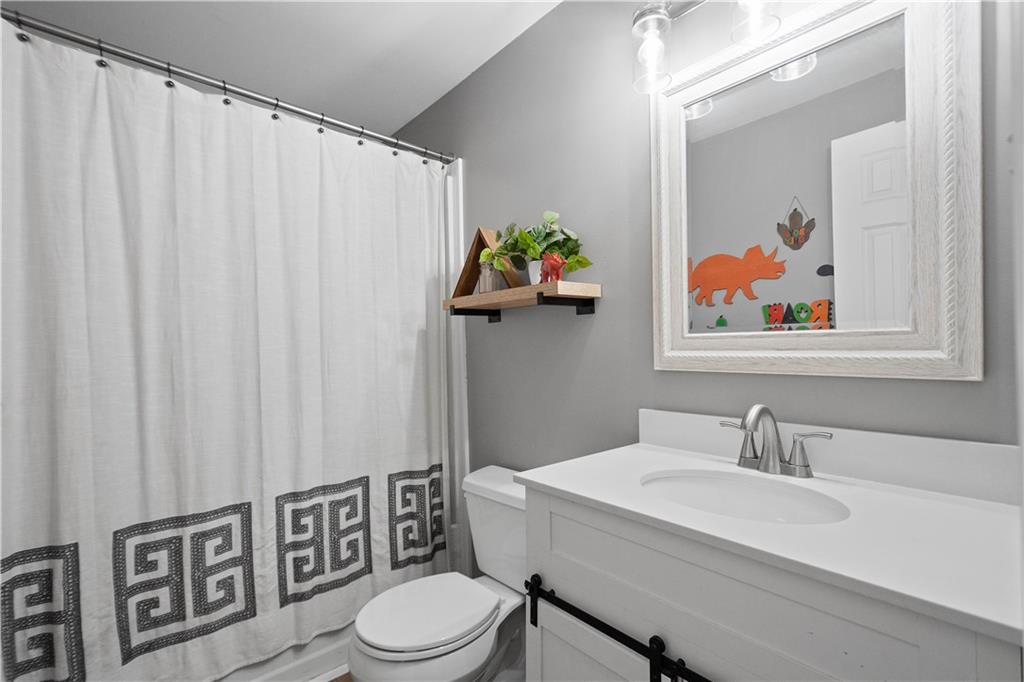 201 Arcola Drive Coraopolis, PA 15108 - Photo 24 of 33 a bathroom with a sink mirror and toilet