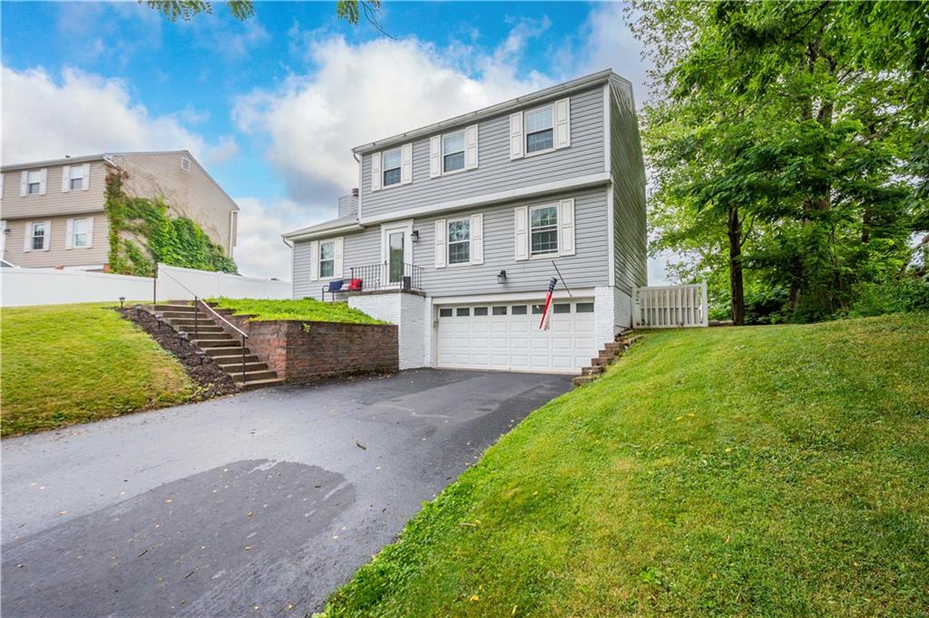 201 Arcola Drive Coraopolis, PA 15108 - Photo 3 of 33 a front view of a house with garden