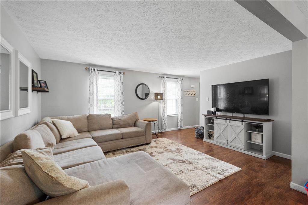 201 Arcola Drive Coraopolis, PA 15108 - Photo 5 of 33 a living room with furniture and a flat screen tv