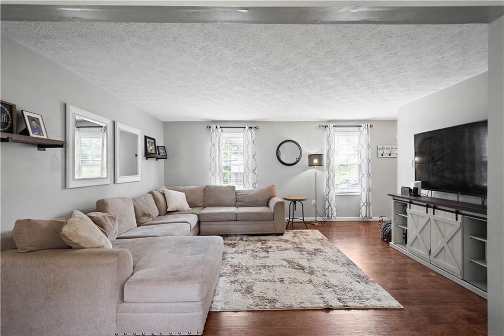 201 Arcola Drive Coraopolis, PA 15108 - Photo 6 of 33 a living room with furniture and a flat screen tv