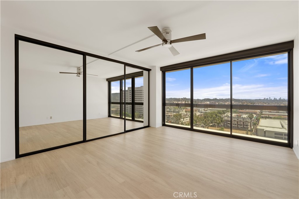 222 Monterey Road, Unit 901 Glendale, CA 91206 - Photo 4 of 68 an empty room with sliding glass door and mountain view