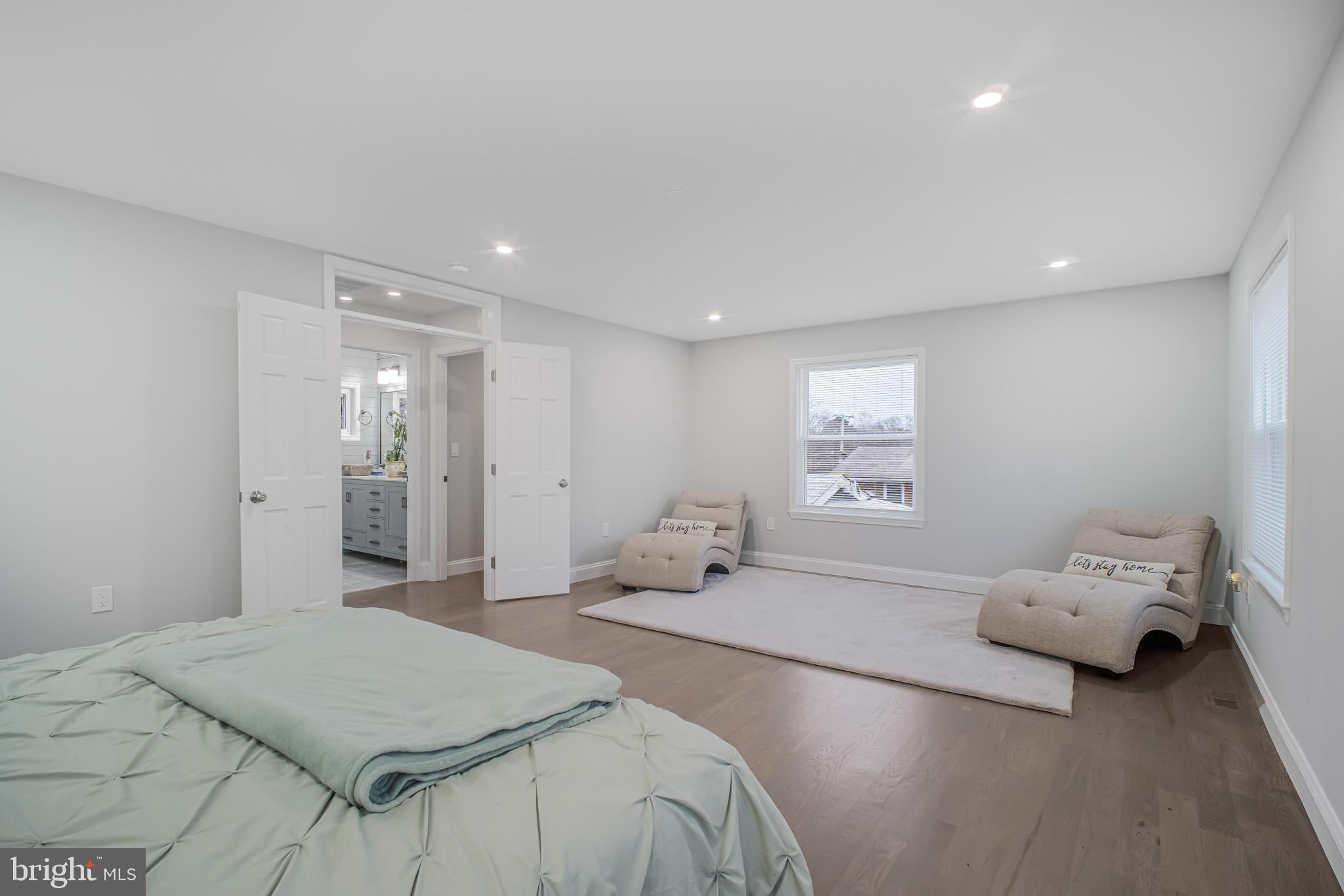 8227 Frye Road Alexandria, VA 22309 - Photo 12 of 45 a spacious bedroom with a bed and a window