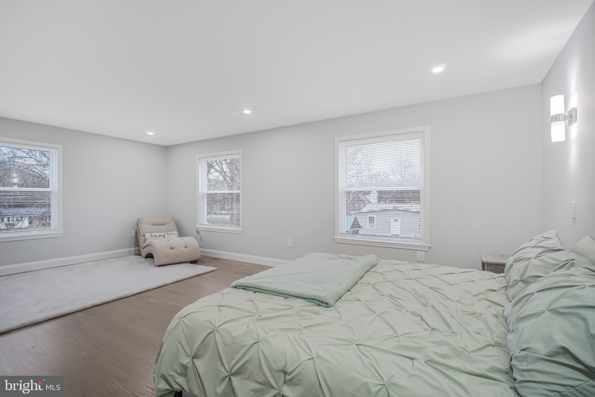 8227 Frye Road Alexandria, VA 22309 - Photo 15 of 45 a bedroom with a large bed and a window