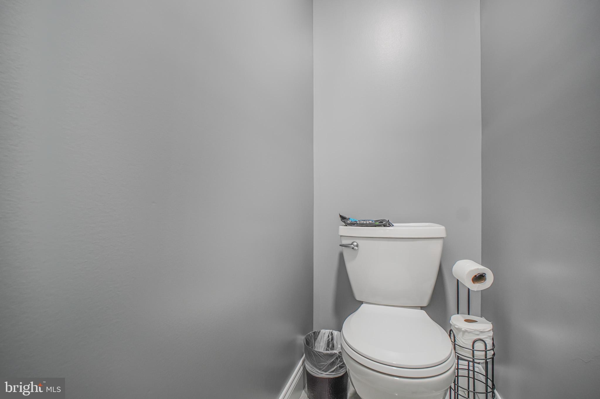 8227 Frye Road Alexandria, VA 22309 - Photo 19 of 45 a white toilet sitting next to a white wall
