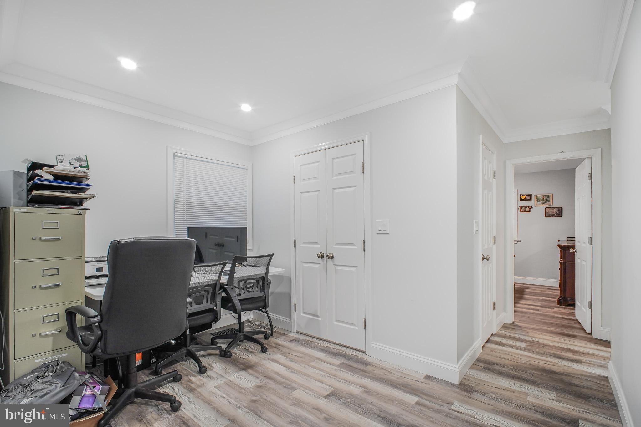 8227 Frye Road Alexandria, VA 22309 - Photo 20 of 45 a view of a workspace with furniture and wooden floor