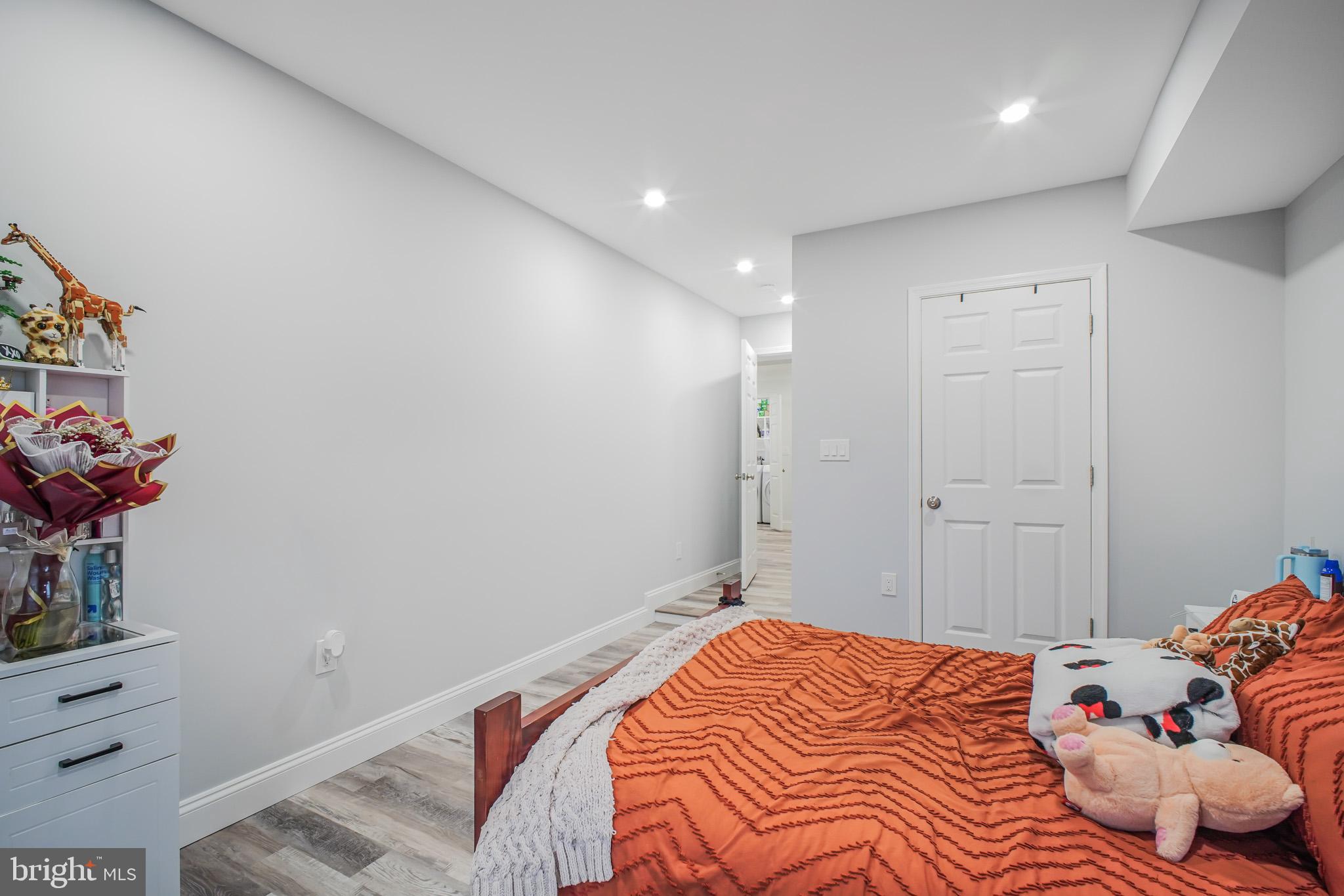 8227 Frye Road Alexandria, VA 22309 - Photo 26 of 45 a bedroom with a bed and a dresser