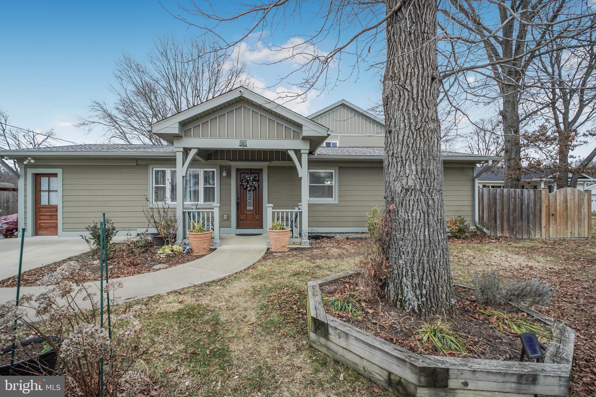 8227 Frye Road Alexandria, VA 22309 - Photo 3 of 45 a front view of a house with garden