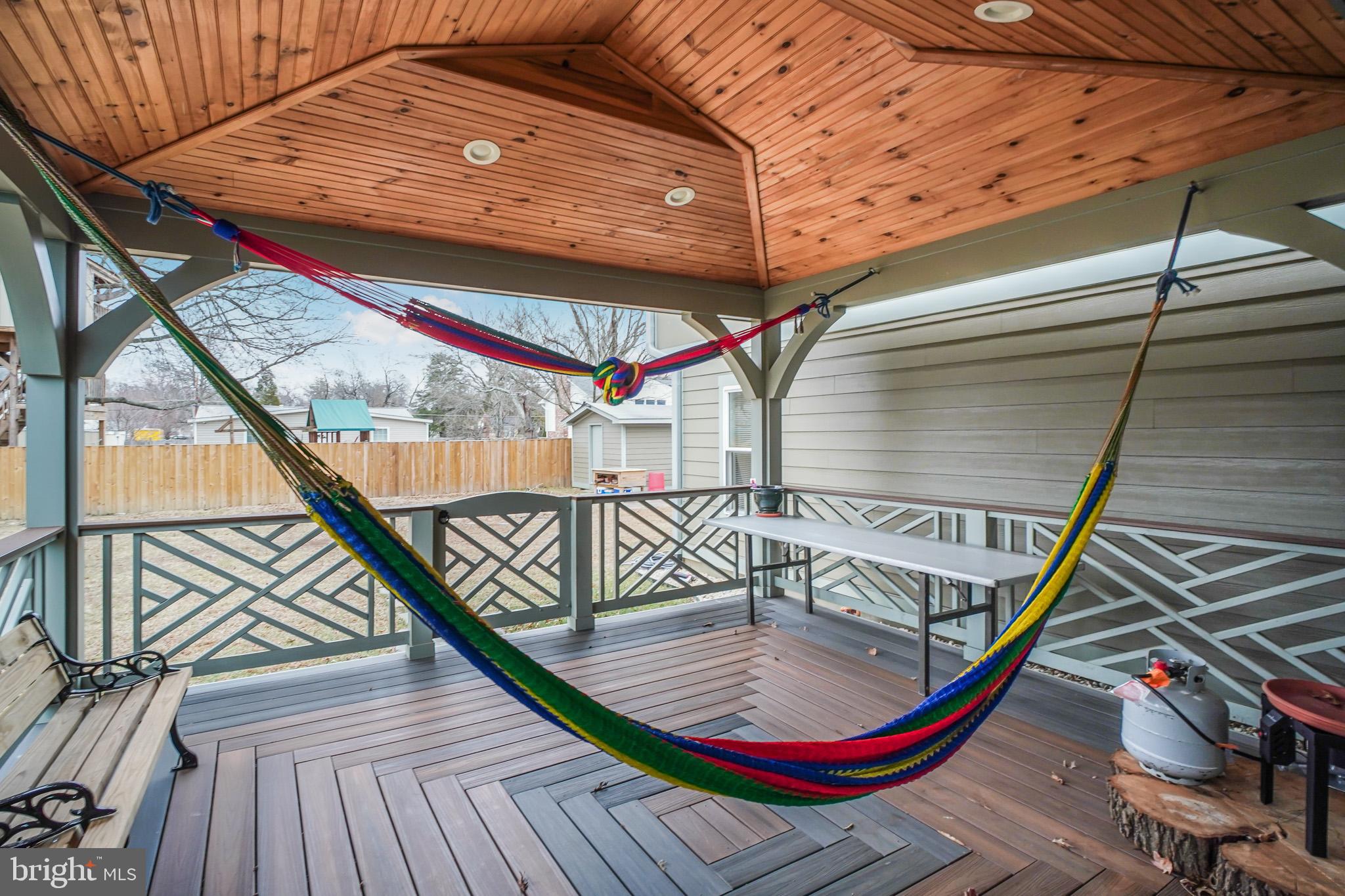 8227 Frye Road Alexandria, VA 22309 - Photo 33 of 45 a balcony with wooden floor and furniture