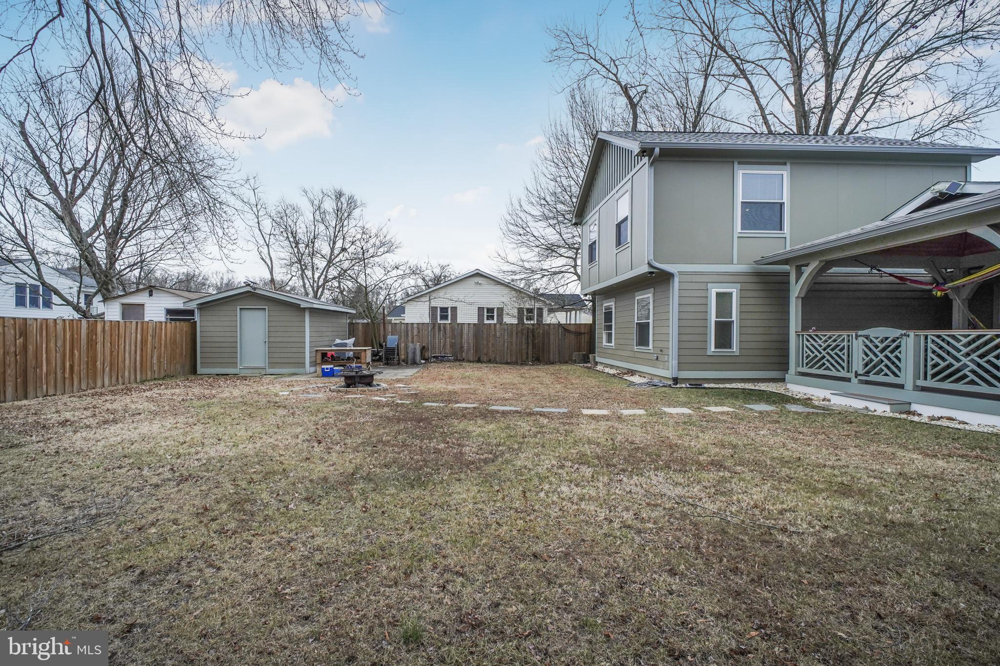 8227 Frye Road Alexandria, VA 22309 - Photo 36 of 45 a view of a house with a yard and garage