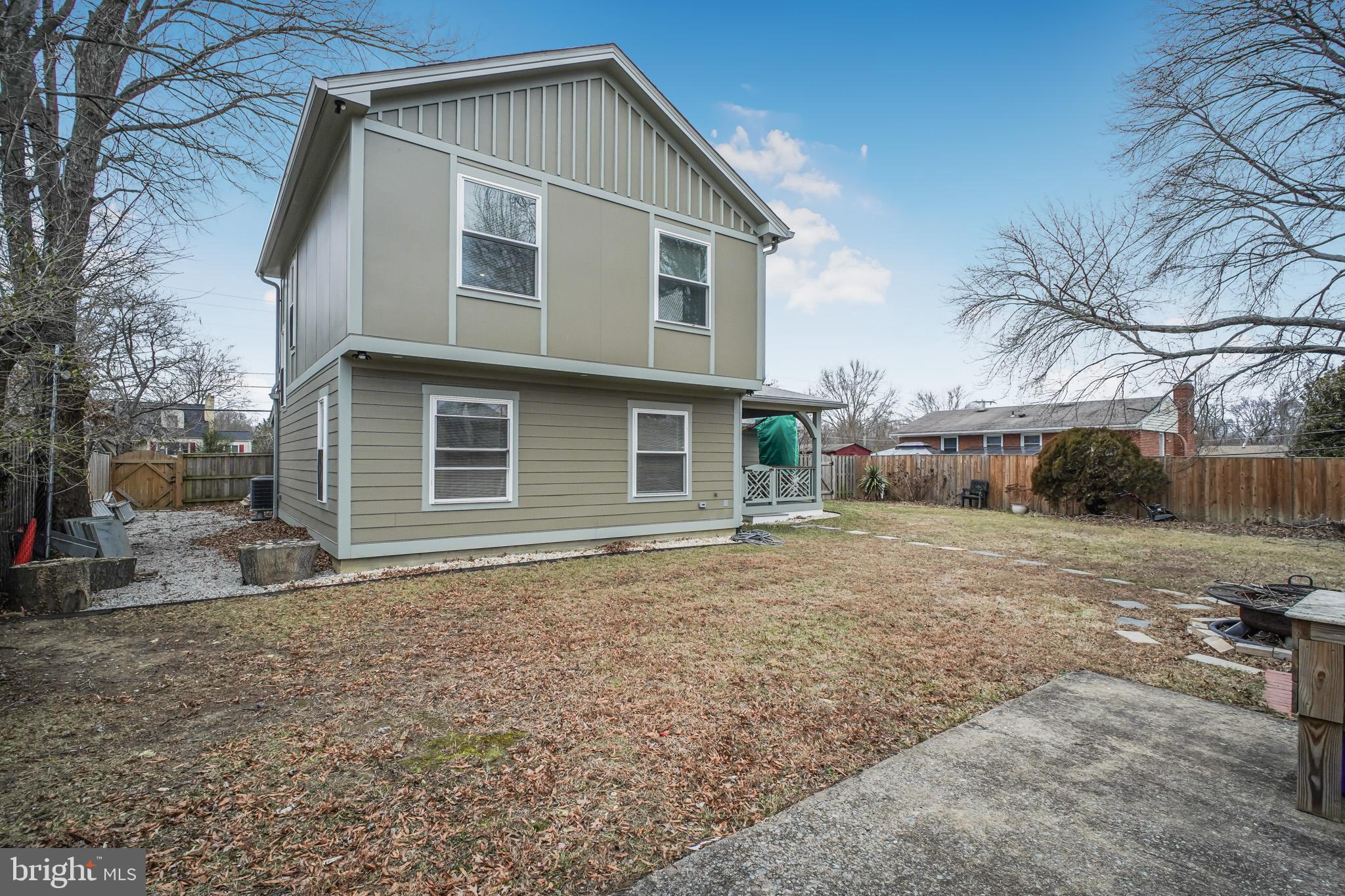 8227 Frye Road Alexandria, VA 22309 - Photo 39 of 45 a front view of a house with a yard and garage