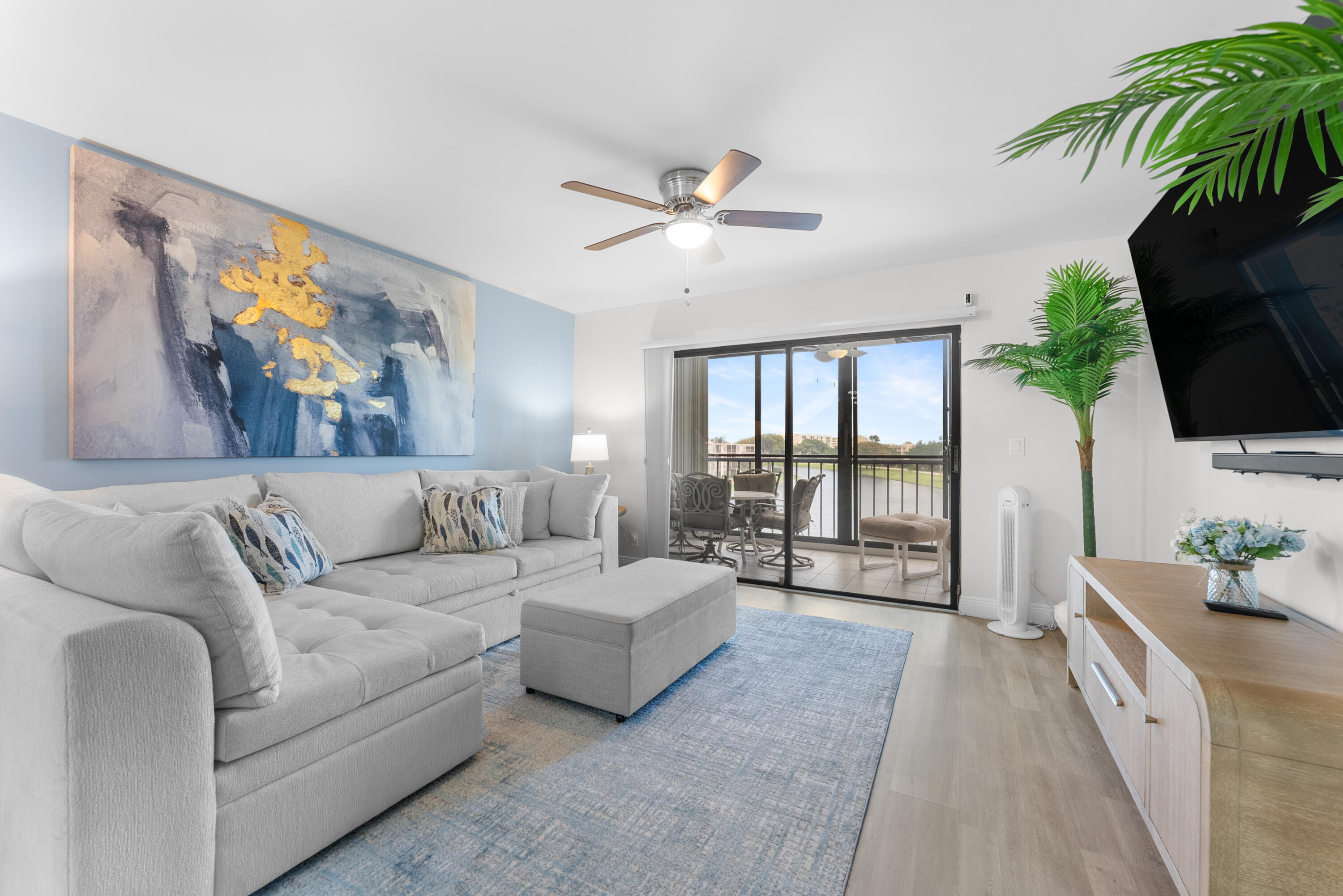 14500 Stirling Way, Unit 403 Delray Beach, FL 33446 - Photo 11 of 47 a living room with furniture and a flat screen tv