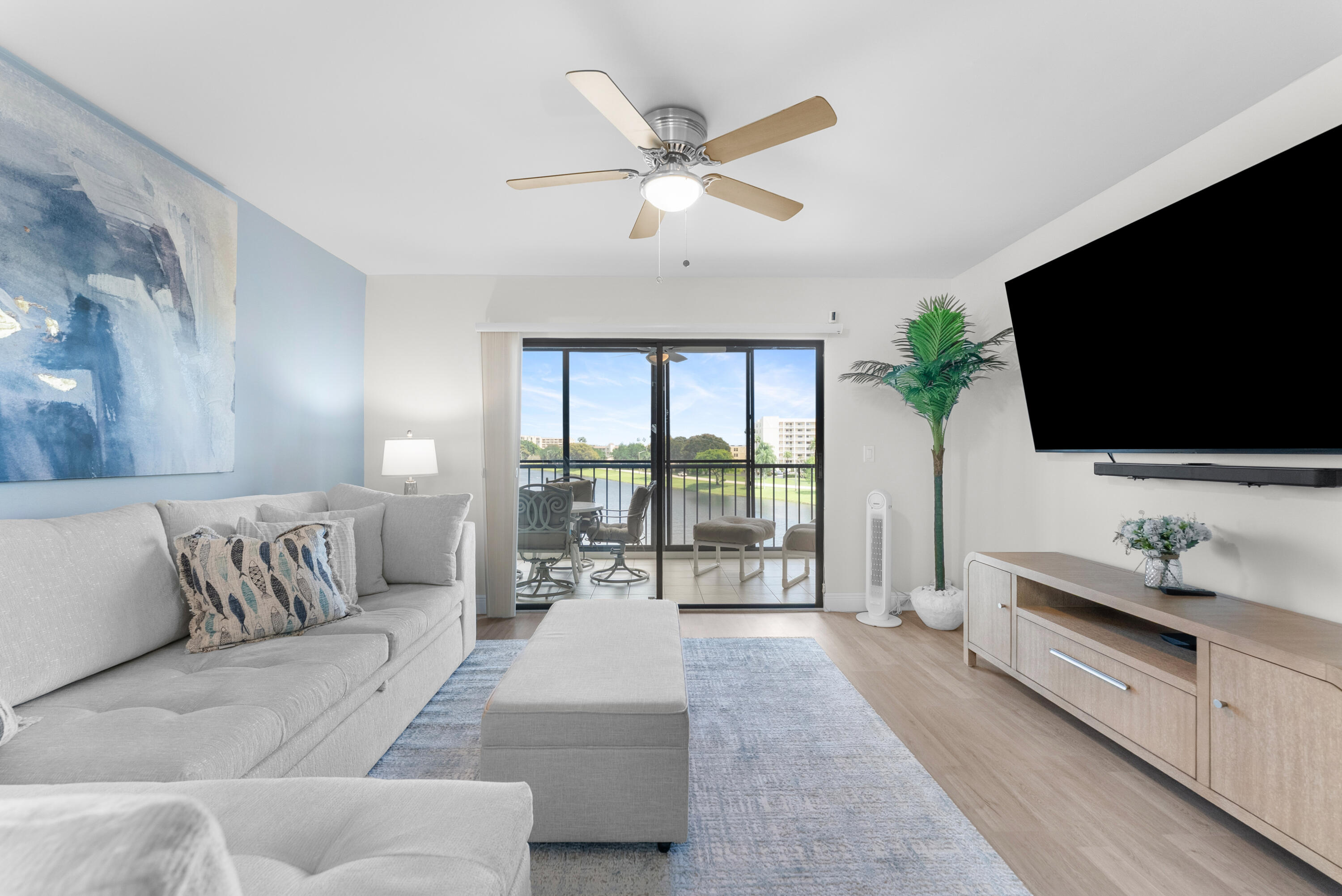 14500 Stirling Way, Unit 403 Delray Beach, FL 33446 - Photo 12 of 47 a living room with furniture and a flat screen tv