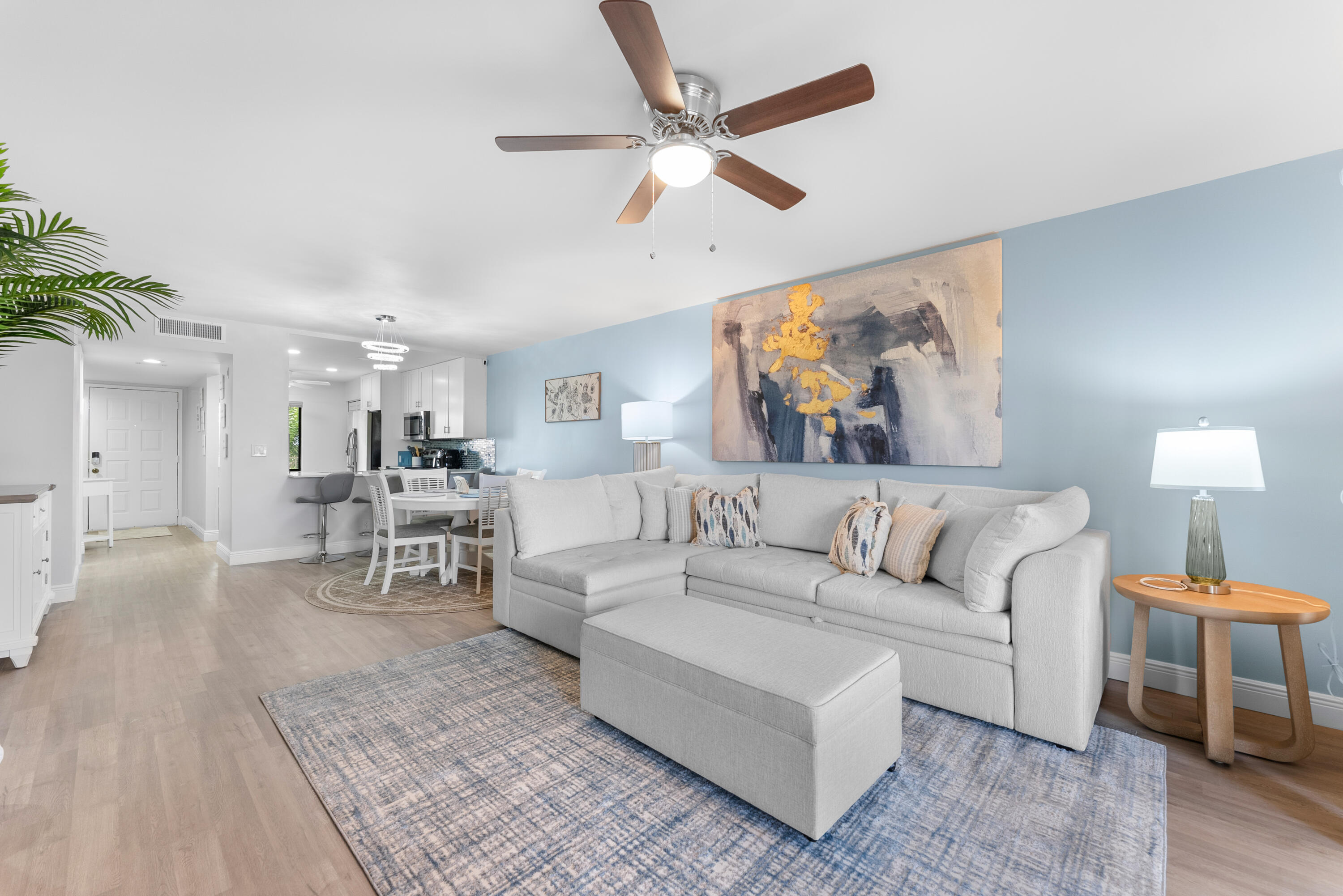 14500 Stirling Way, Unit 403 Delray Beach, FL 33446 - Photo 15 of 47 a living room with furniture and a painting on the wall