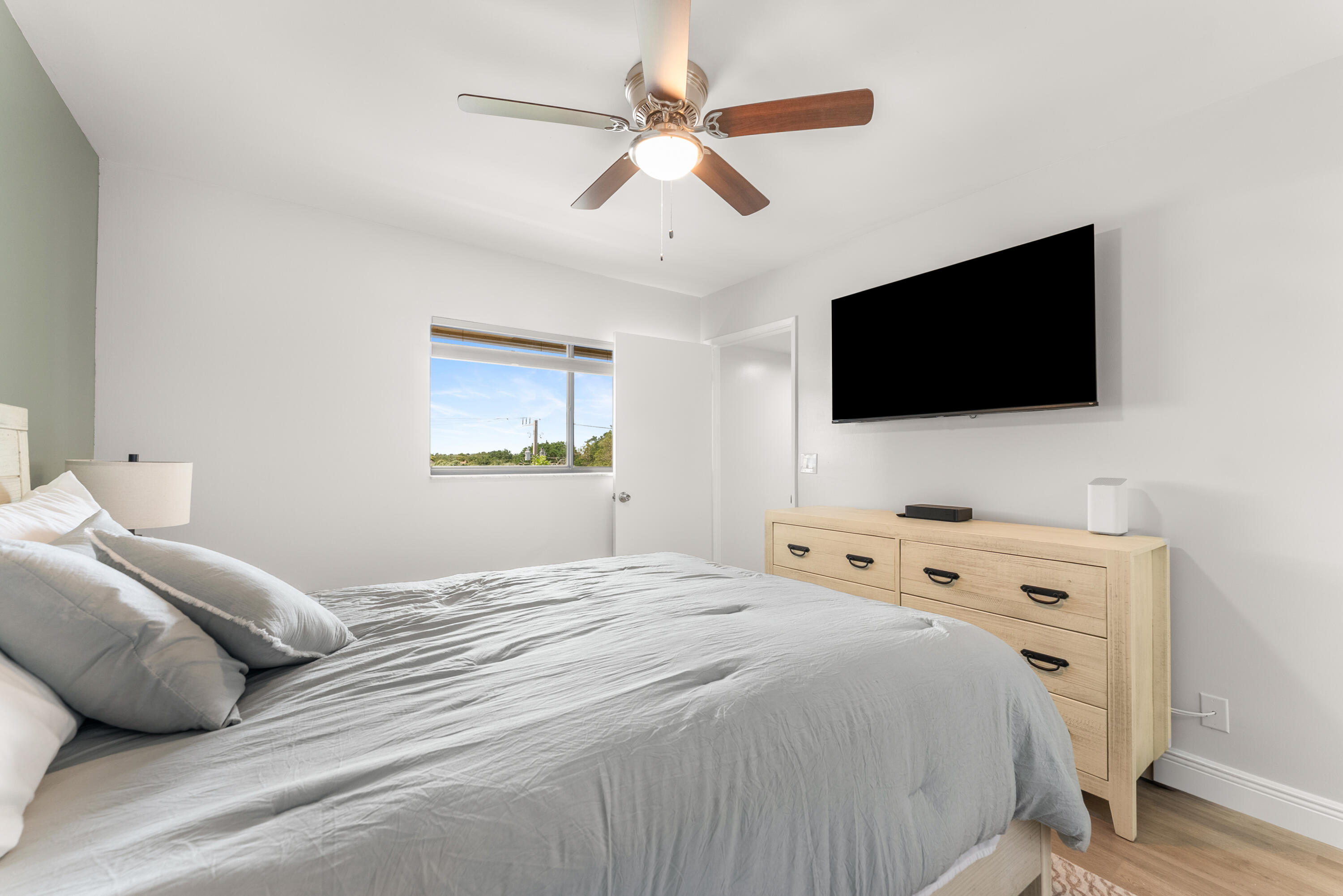 14500 Stirling Way, Unit 403 Delray Beach, FL 33446 - Photo 16 of 47 a bedroom with a bed and a flat screen tv